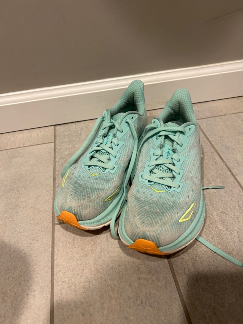 Hoka Women's Running Sneakers in Mint with Yellow Accents. Clifton 9.